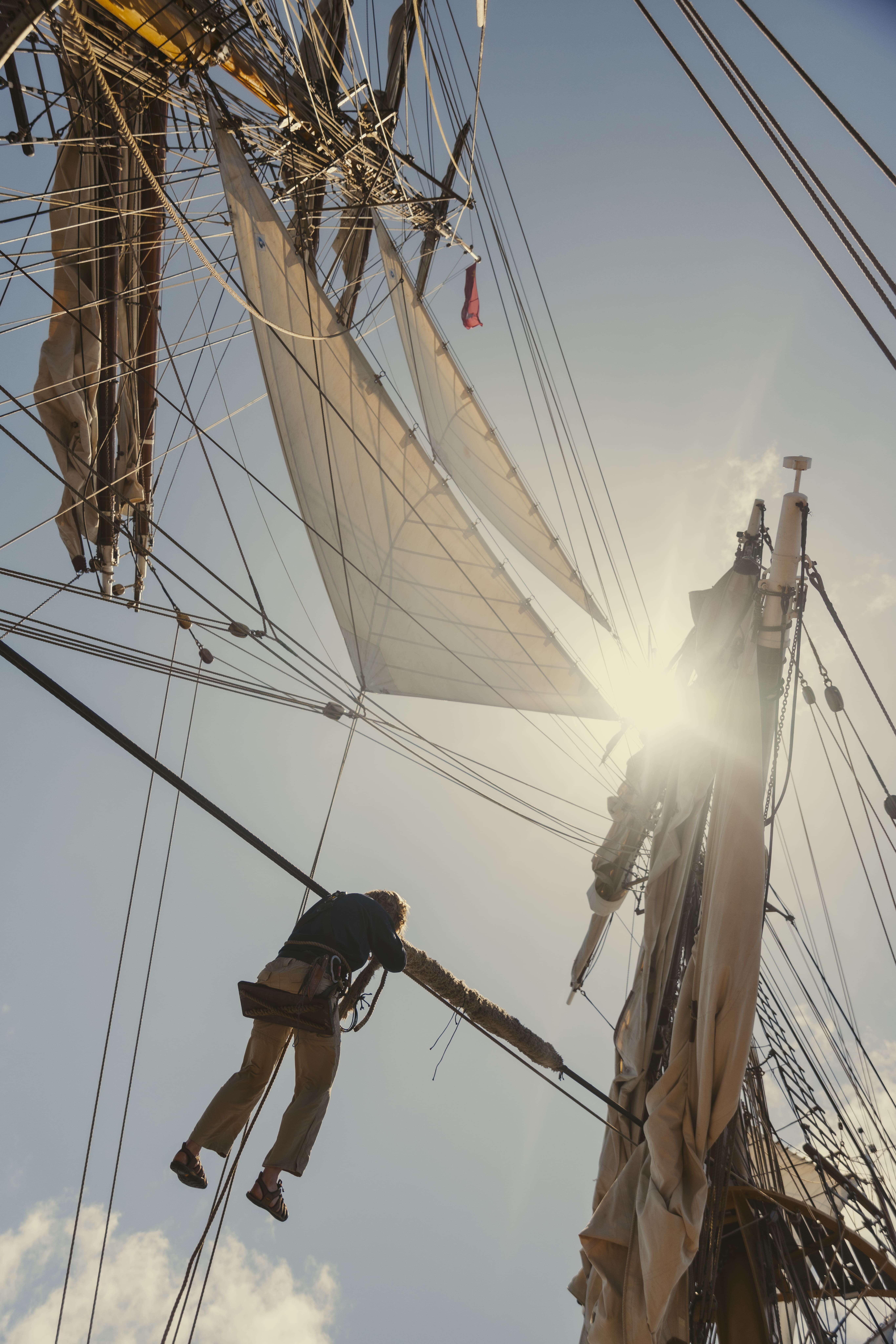 Voyage crew working aloft in the rigging